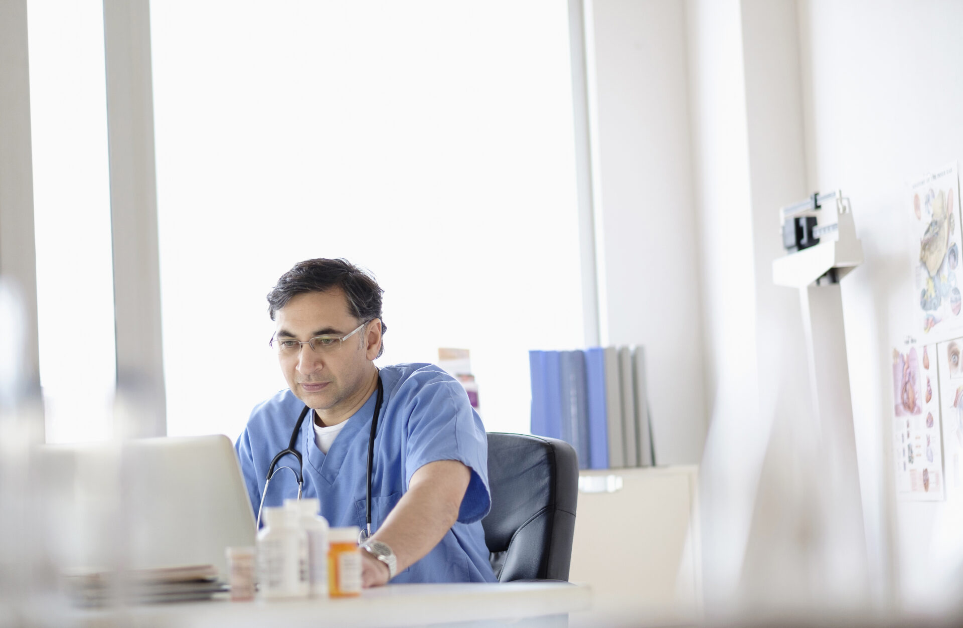 Doctor working on laptop